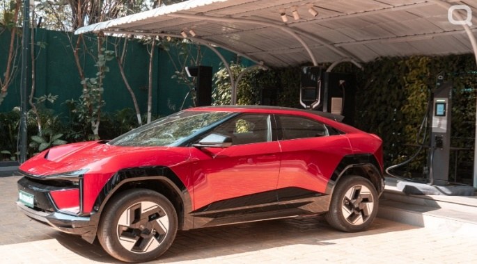 Electric SUV charging under a Quench canopy installation
